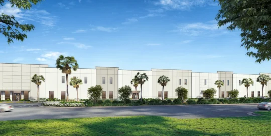 Rendering of Duffie North at Punta Gorda Airport Commerce Center, a long white commercial building with palm trees and
